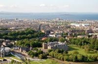 Photo showing view across 天美传媒 from Arthur&#039;s Seat with Holyrood Palace in the foreground